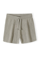 Detail of boys' hellkhaki knitted shorts with elasticated waistband and drawstring.