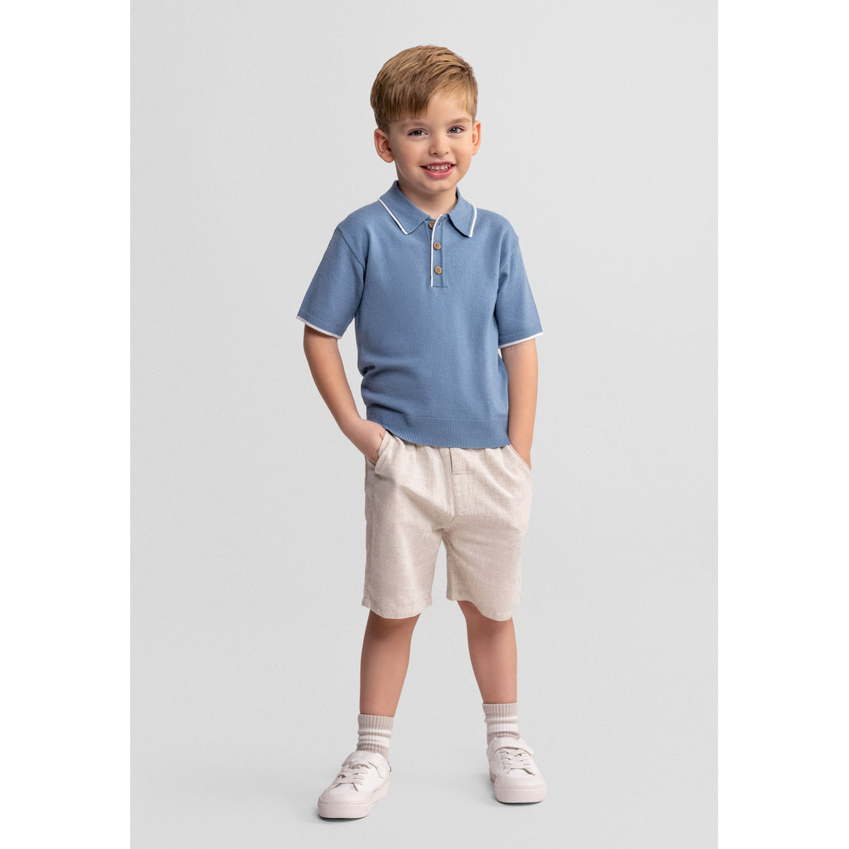 Boys' polo shirt and shorts set in blue and cream — complete product view for square Shop card