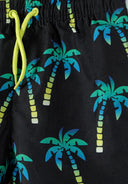 Detail of boys swimming shorts with black and teal palm print, featuring an elasticated waistband and drawstring.