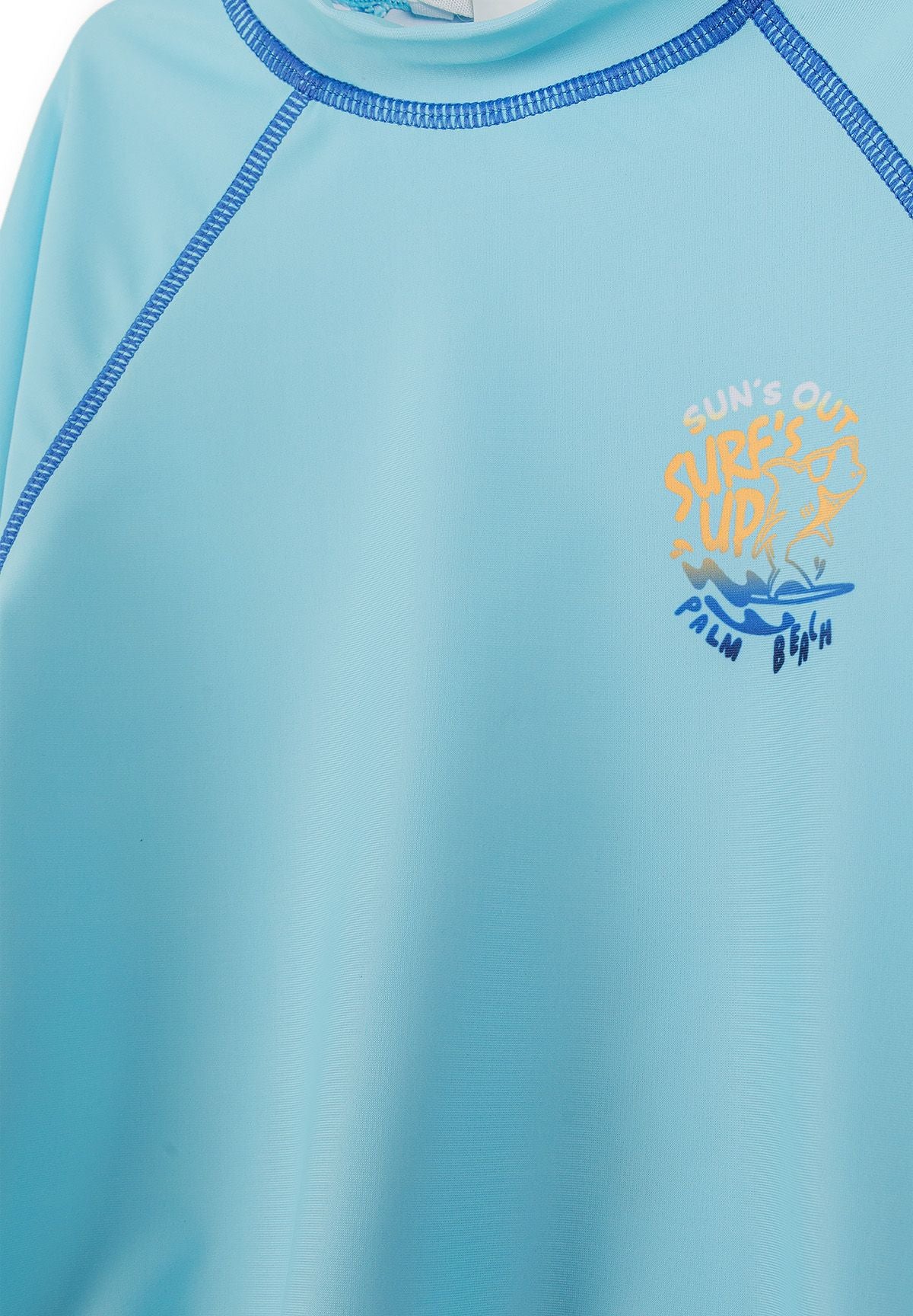 Turquoise, orange and blue rash vests, chest and seam detail.