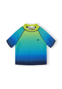 Close-fitting boys rash top with short sleeves in a vibrant gradient design of blue and lime shades