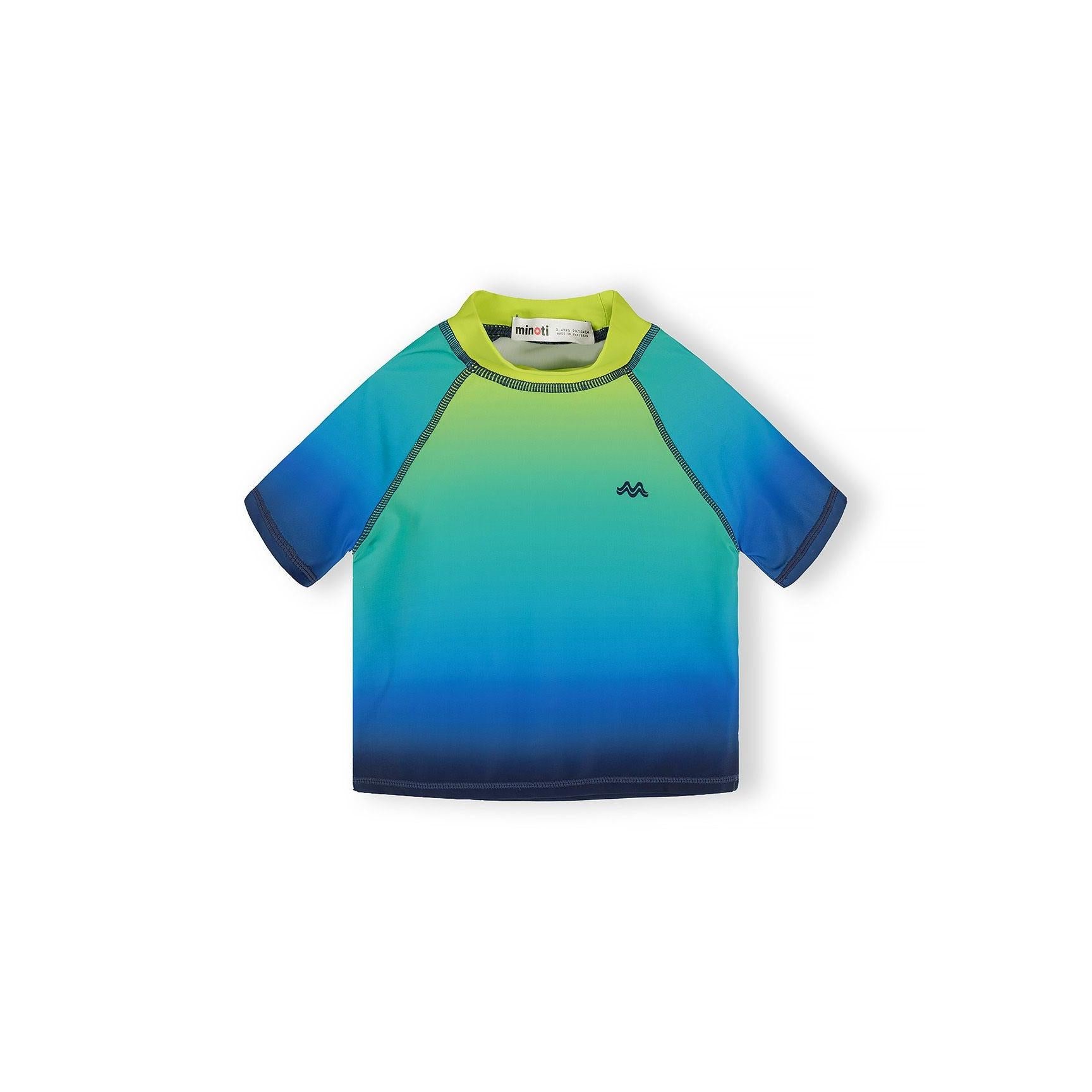 Close-up of Minoti care label and UPF 50+ protection tag attached to blue and green gradient swimwear