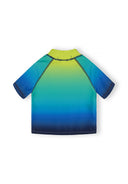Close-fitting boys rash top with short sleeves featuring a vibrant gradient design in navy, blue, and lime colors.