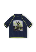Navy boys rash top with lime stitching and surfer wave design on the back, short sleeve close-fitting style.