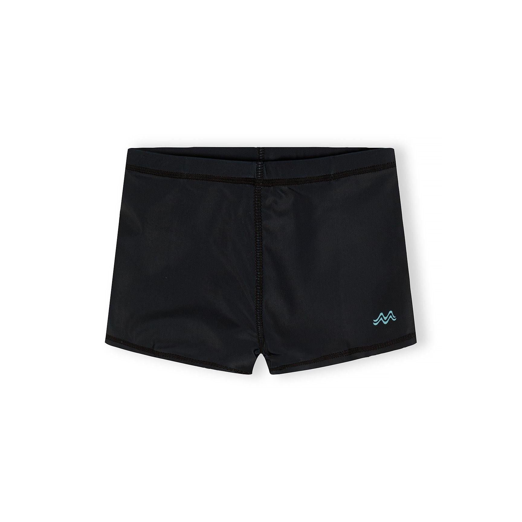 Product label and tag attached to blue gradient swim shorts showing Minoti branding and UPF 50+ fabric protection information