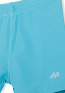 Close-up of turquoise boys swim shorts with smooth fabric and simple design detail for kids fashion.