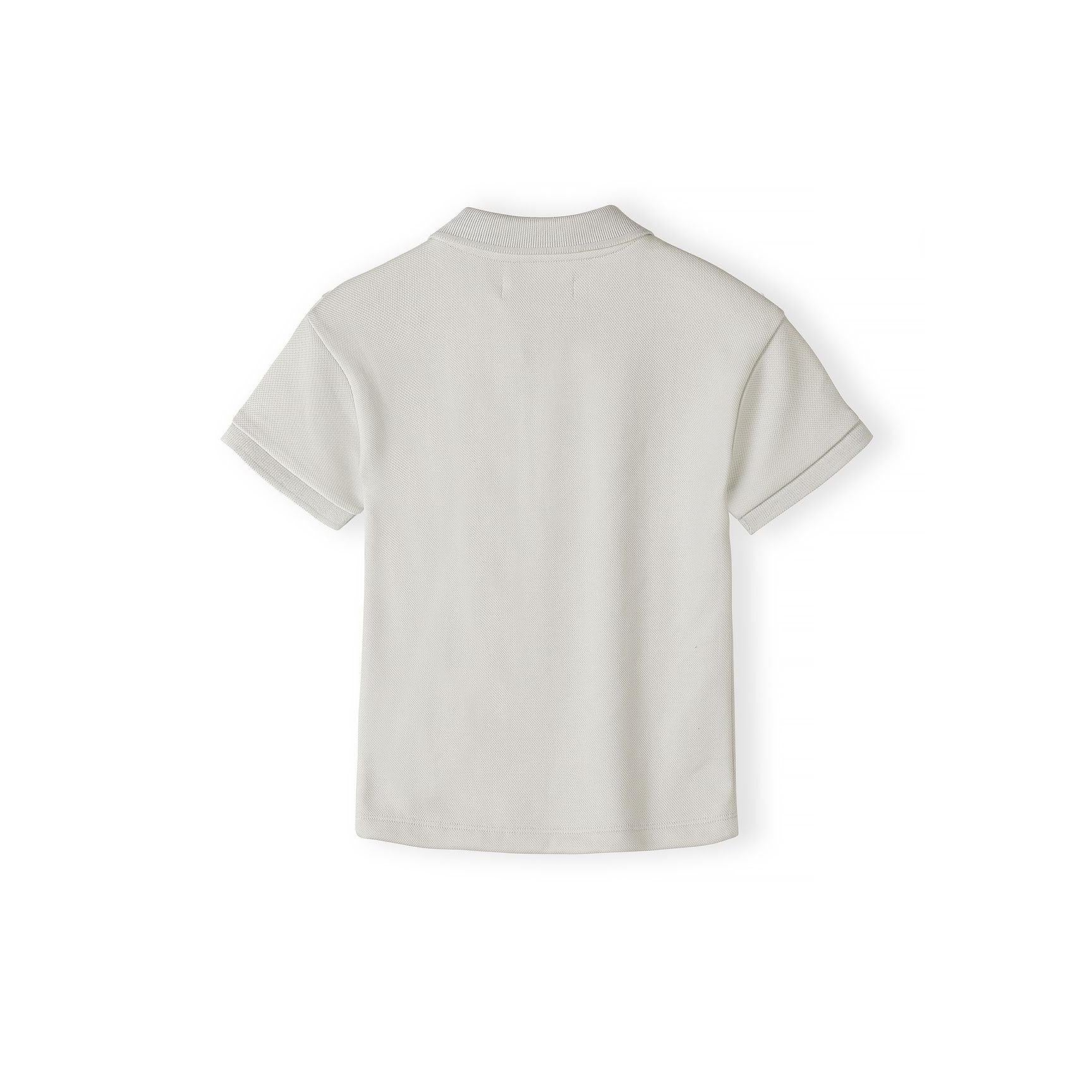 Back view of grey pique polo shirt laid flat showing textured fabric and ribbed collar construction on white background