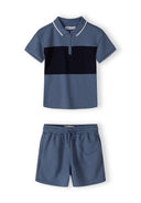 Boys navy blue polo shirt with zip collar and matching shorts, front view.