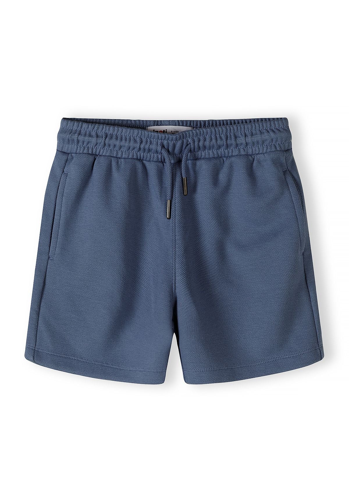 Detail of navy blue shorts with elastic waistband and drawstring.
