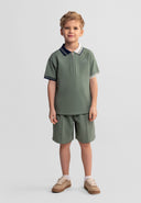 Boys muted teal polo shirt with contrasting collar and shorts set, front view.