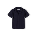 Boys navy blue short-sleeve polo shirt with button placket, front view.
