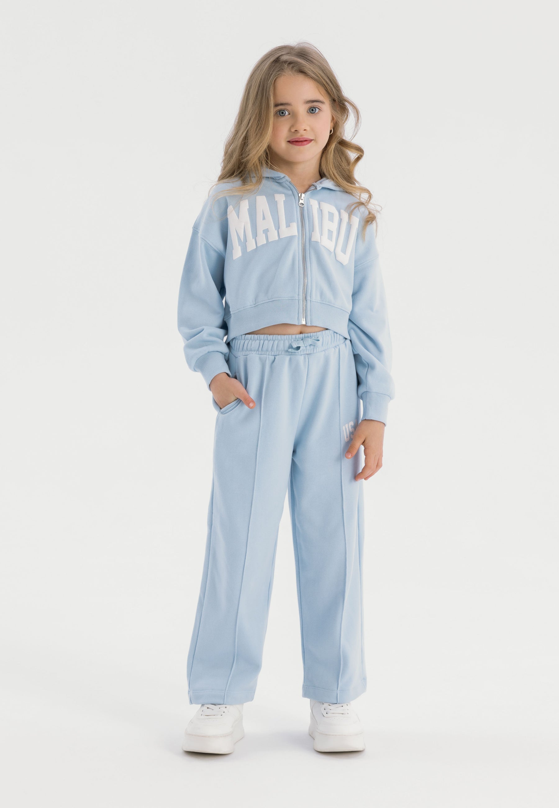 Cropped zip-through hoodie and wide leg jogger set in blue, featuring a kangaroo pocket and elasticated waistband.