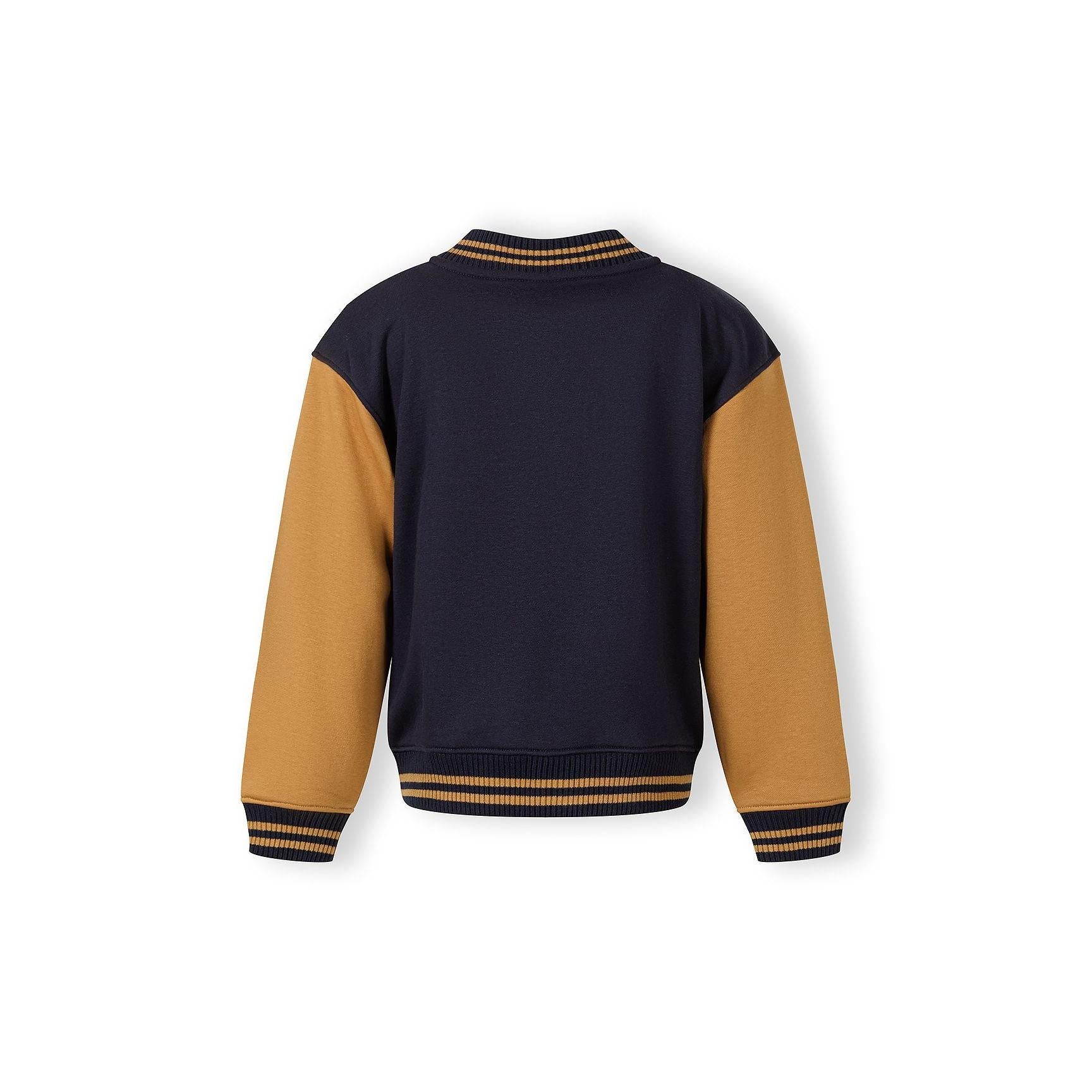 Back view of navy baseball jacket with toffee sleeves showing ribbed collar and cuffs on white background