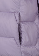 Detail of a lightweight purple nylon jacket with quilted padding and side pockets.