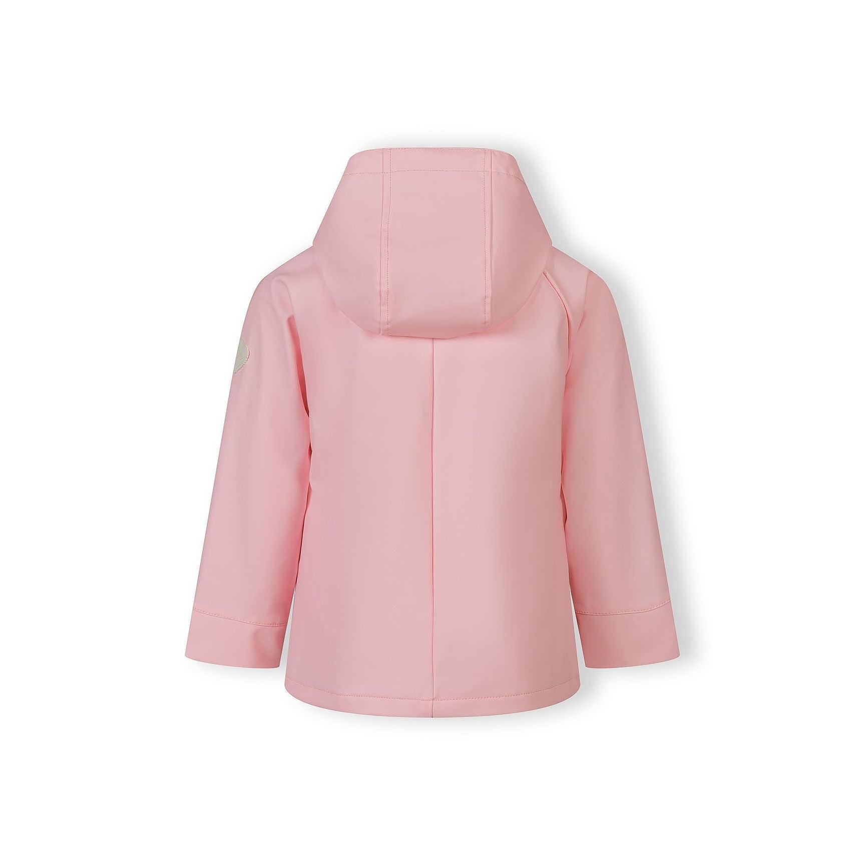 Close-up detail of pink rain jacket chest pocket with button flap closure, showing textured waterproof fabric and neat stitching against soft pink background