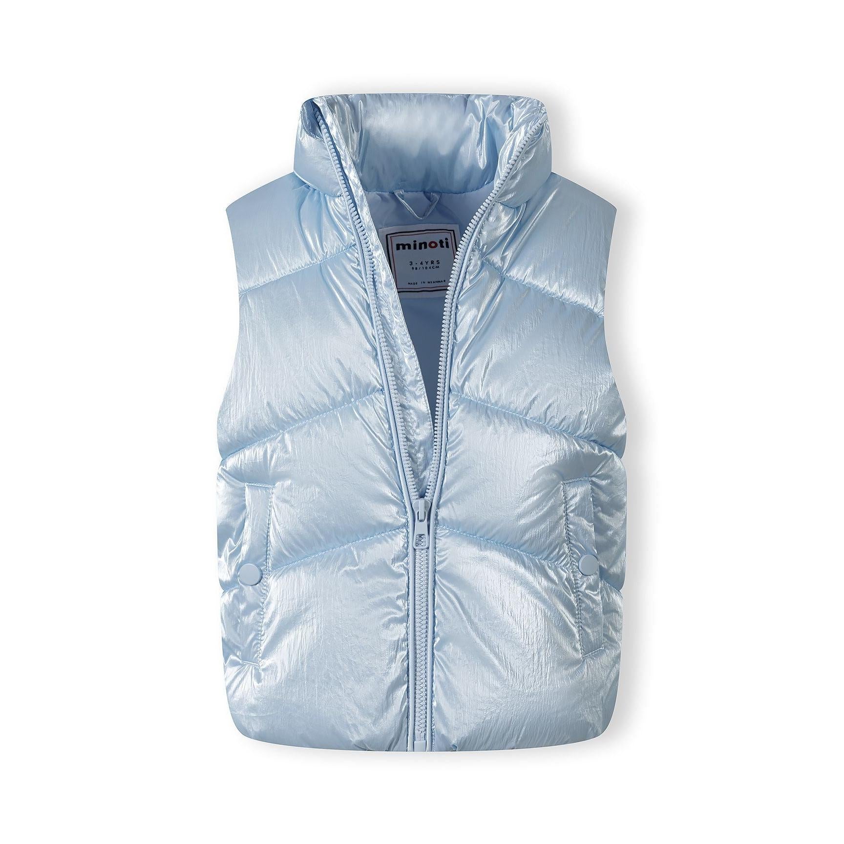 Close-up view of metallic blue quilted waistcoat showing Minoti brand label inside collar and detailed quilted texture on white background