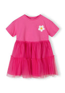 Girls' pink jersey dress with layered tulle skirt and crochet flower, front view.