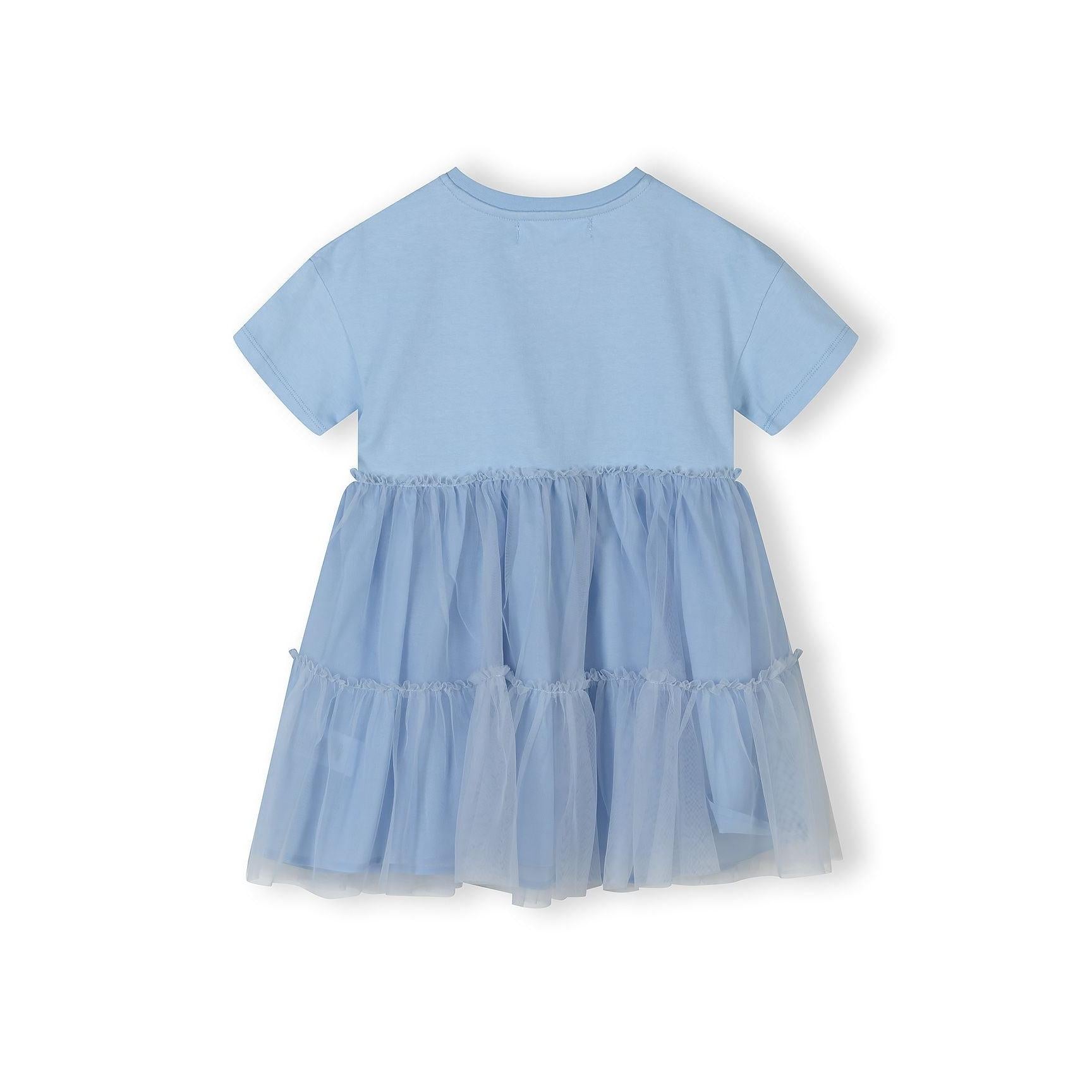 Back view of blue cotton and tulle dress showing layered skirt construction and short sleeves on white background
