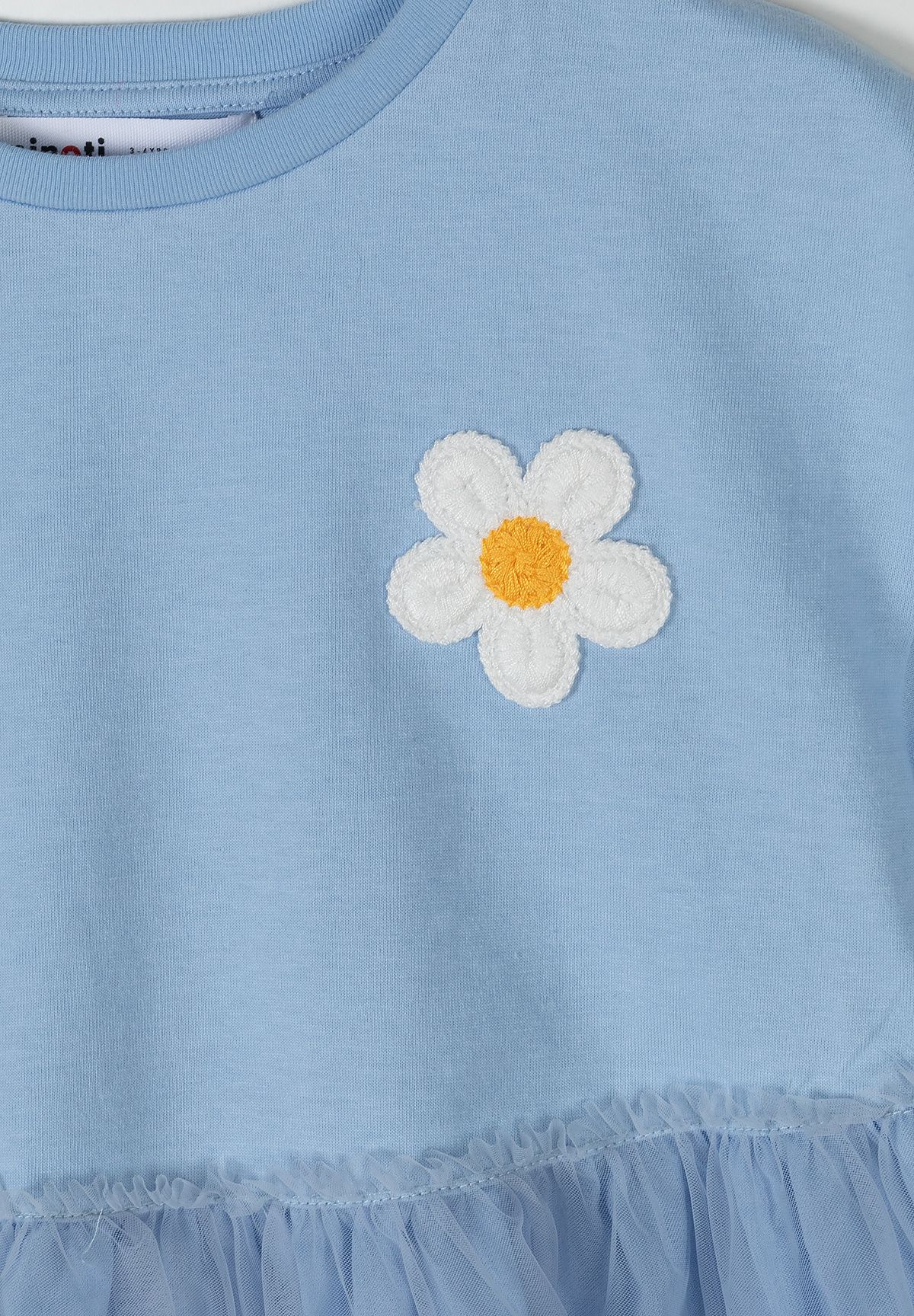 Light blue tiered mesh skirt dress, daisy detail.