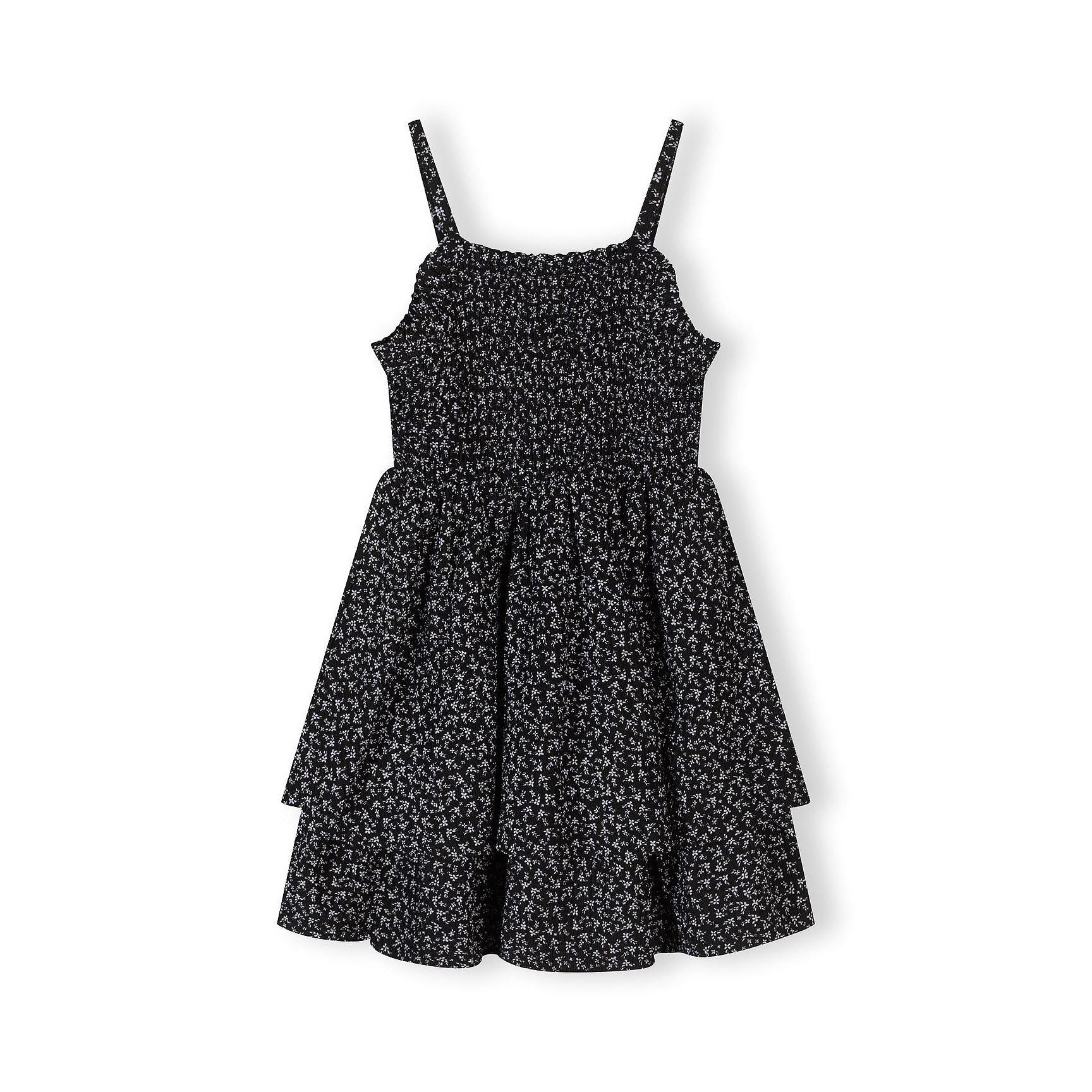 Black sleeveless dress with small floral print featuring tiered ruffle skirt and adjustable thin straps, displayed flat against white background