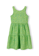 Sleeveless emerald green girls dress with small floral print and tiered design, perfect for kids' summer fashion.