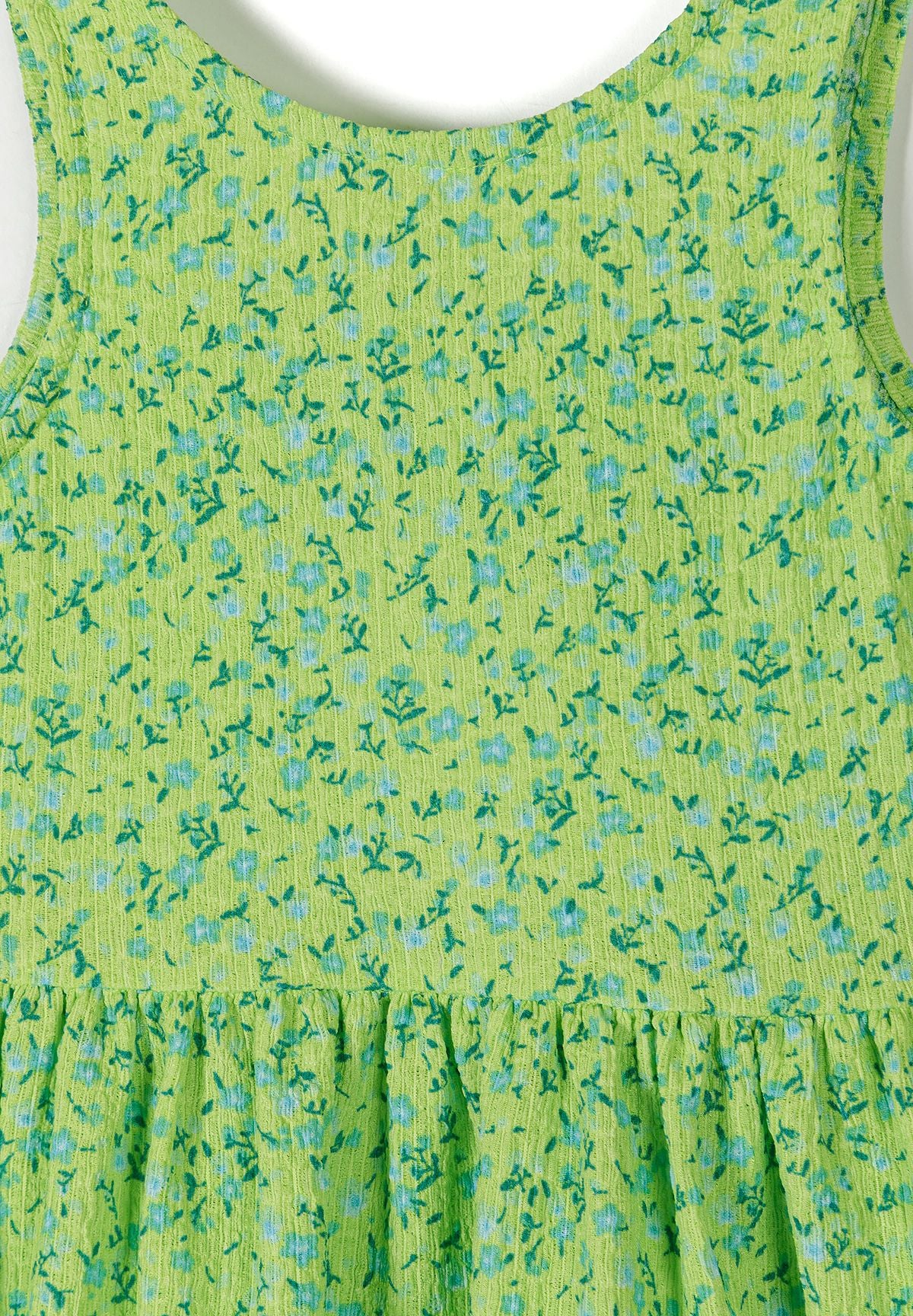 Lime green and blue floral bow-back sundress, floral fabric detail.
