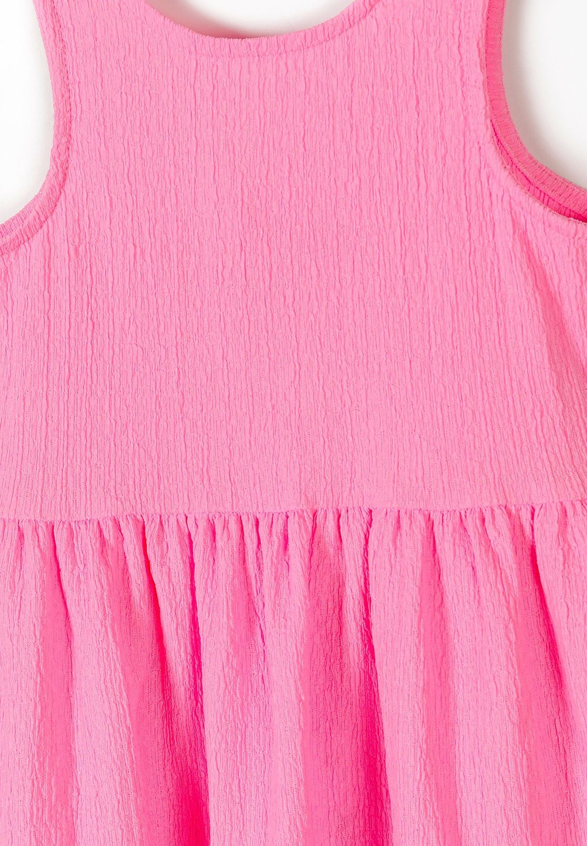 Pink tiered bow-back sundress, fabric detail.