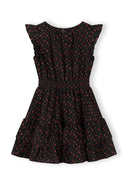 Girls black floral A-line dress with frill sleeves, back view.