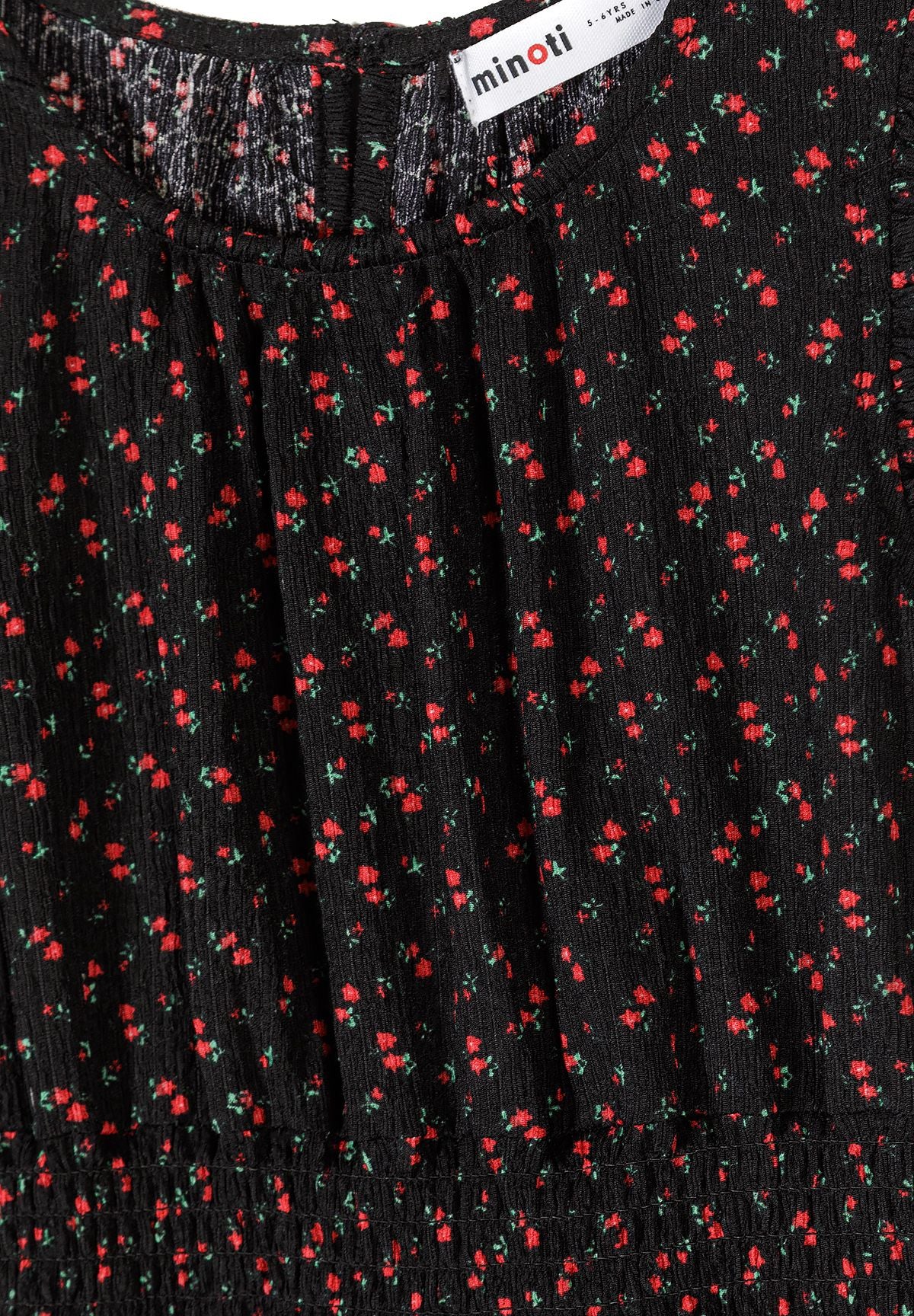 Black and red floral flutter sleeve dress, neckline and waist detail.