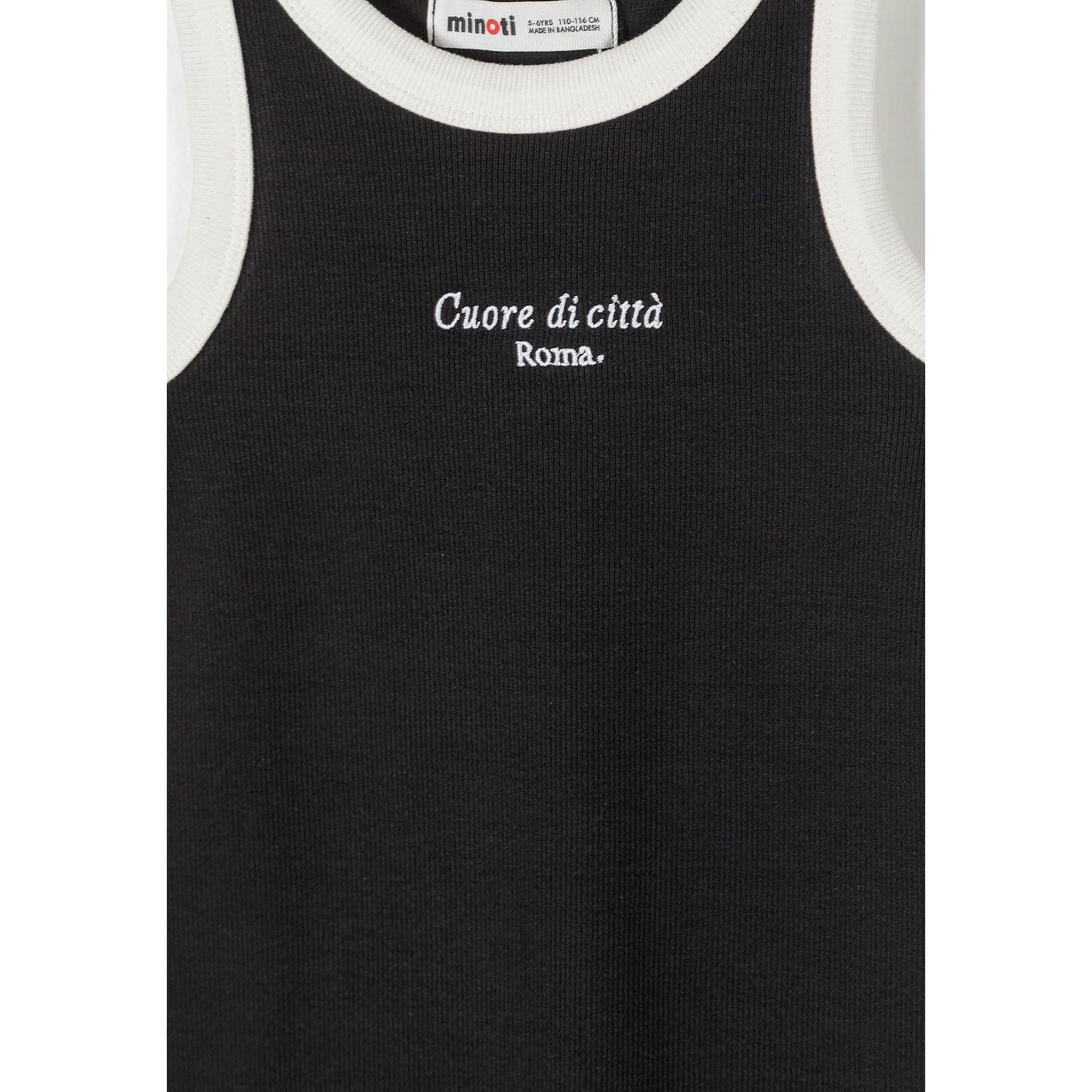 Detail shot of black tank dress showing white Italian text 'Cuore di città Roma' and Minoti label at neckline with white contrast trim