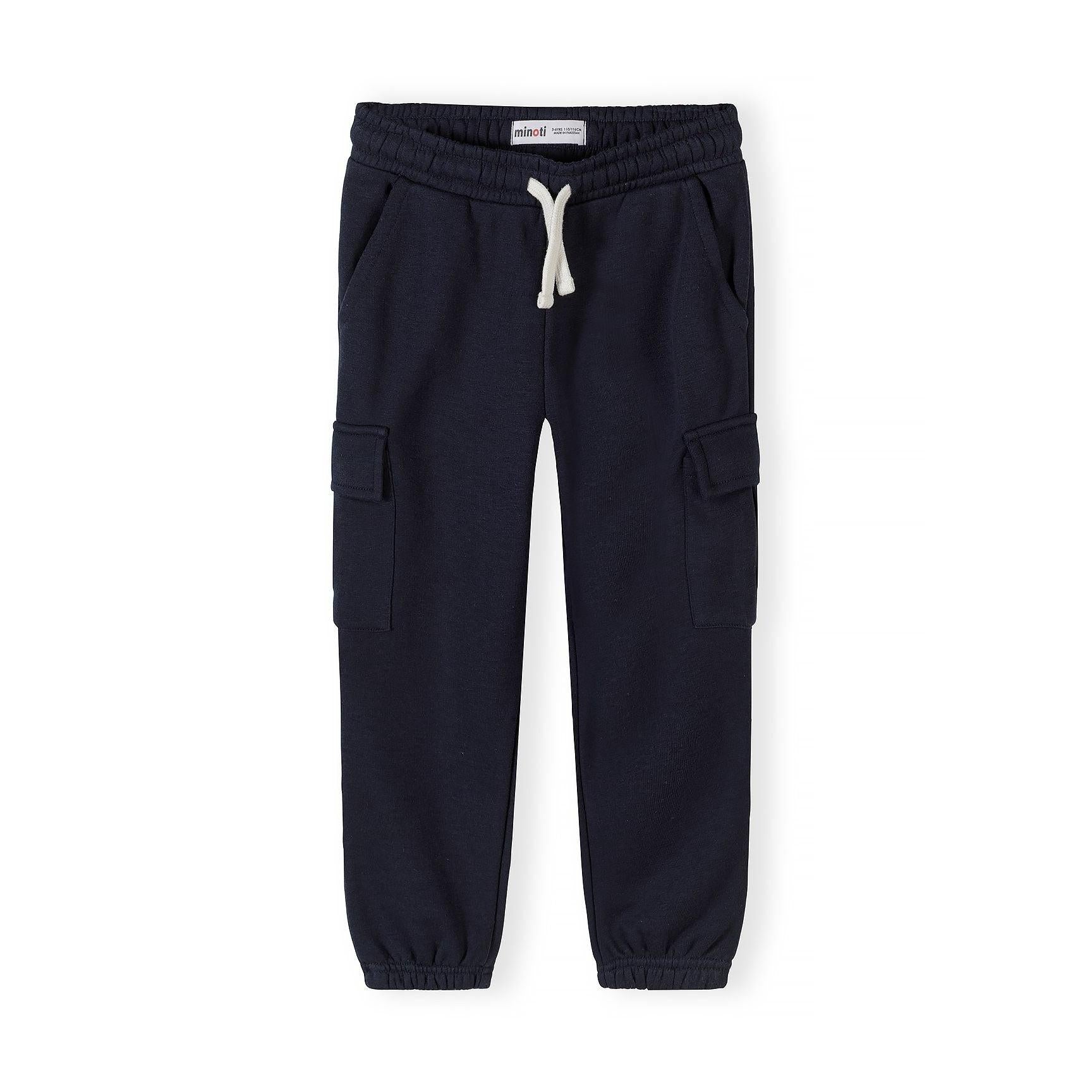 Light pink Minoti cargo joggers displayed flat showing full length view with elasticated waistband, white drawstring, side cargo pockets, and gathered ankle cuffs on white background
