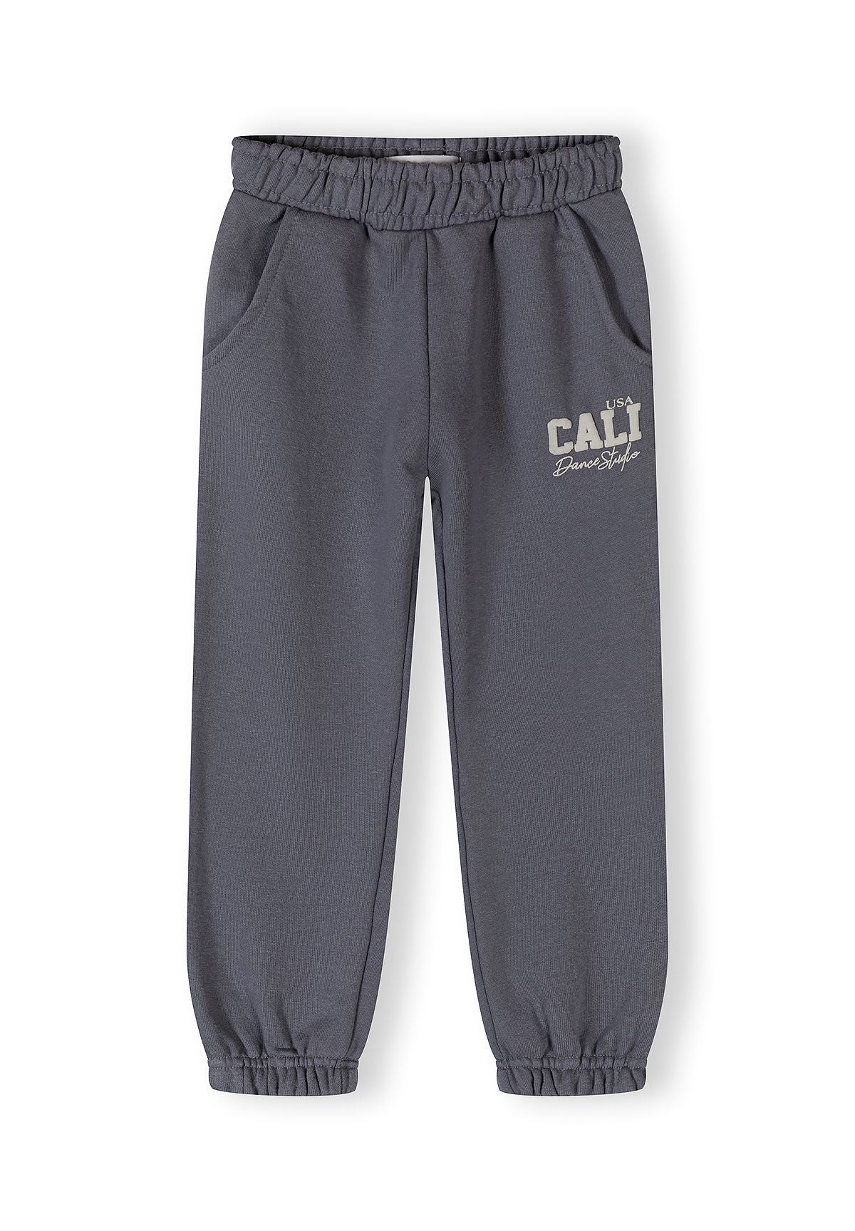 Detail of girls' tapered jogging trousers in blue-grey with elasticated waistband and side pockets.