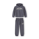 Close-up of blue-grey tracksuit bottoms showing elastic waistband and CALI USA Dance Studio text print on the leg