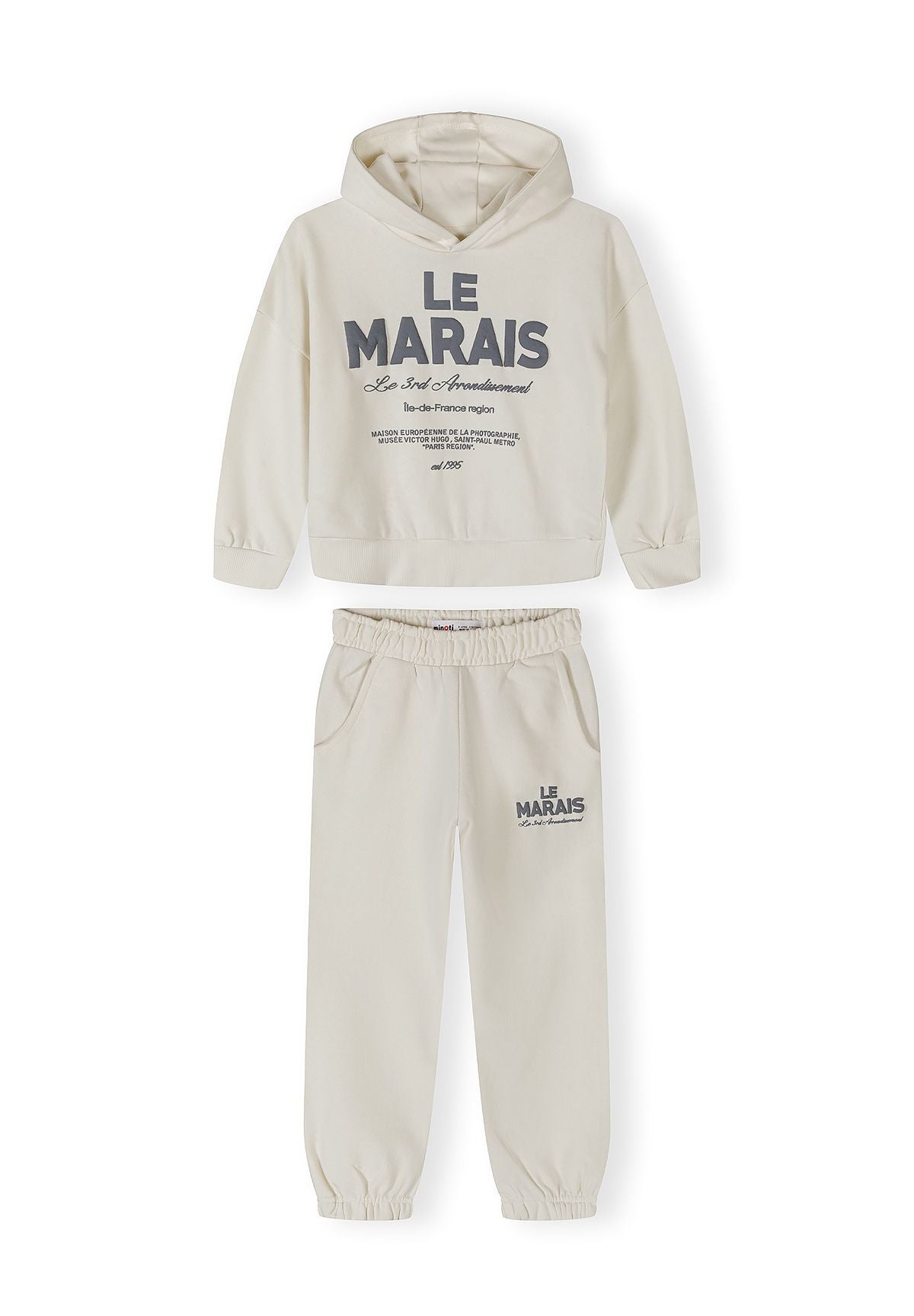 Girls off-white hooded tracksuit with logo, front view.