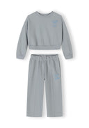 Light blue girls' tracksuit with hooded jacket and wide-leg trousers, front view.