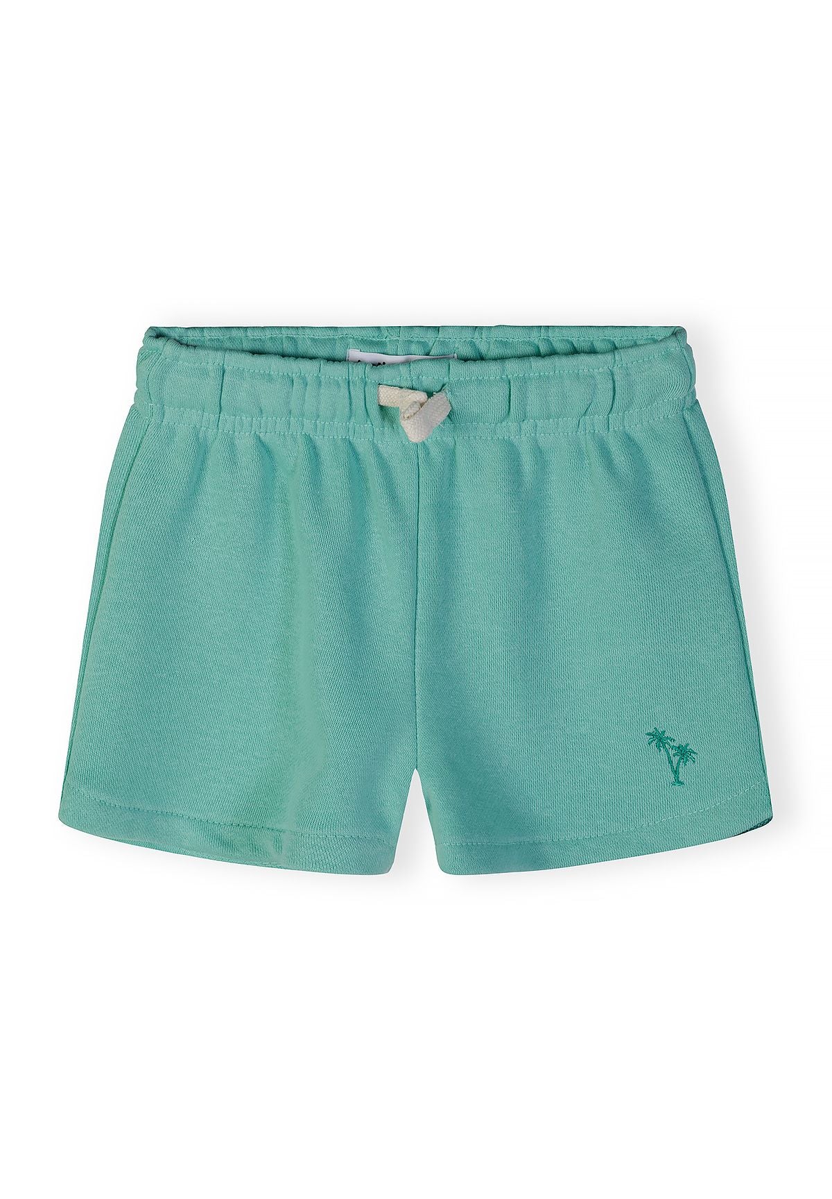 Detail of girls' green cotton blend shorts with elastic waistband and palm tree embroidery.