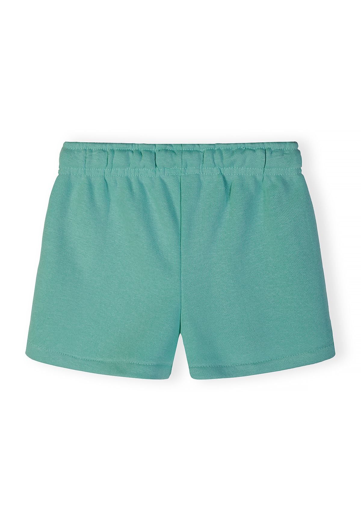 Girls' shorts in light green, back view, featuring an elasticated waistband.