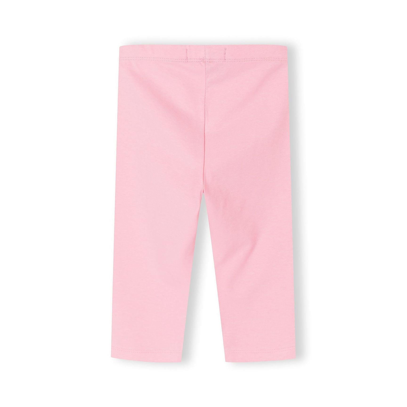 Close-up detail of pink capri leggings showing fabric texture, seam construction and Minoti label at waistband