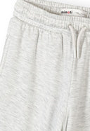 Light grey girls joggers with elasticated waist and drawstring, featuring a soft mottled viscose blend fabric design.