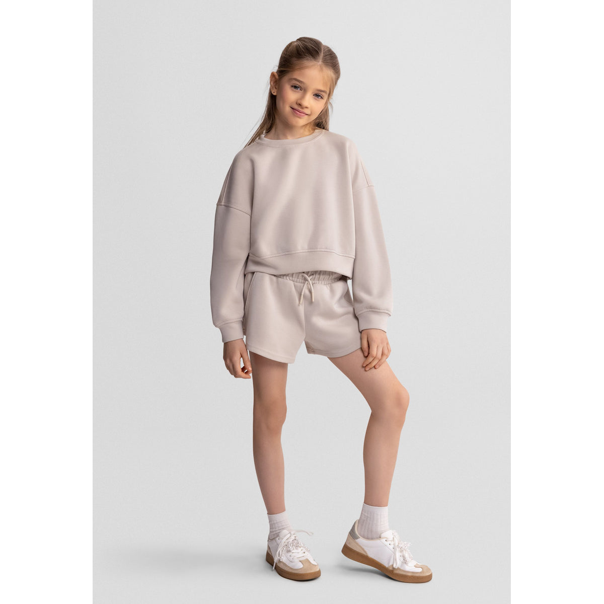 Women's sweatshirt and shorts set in beige — complete product view for square Shop card