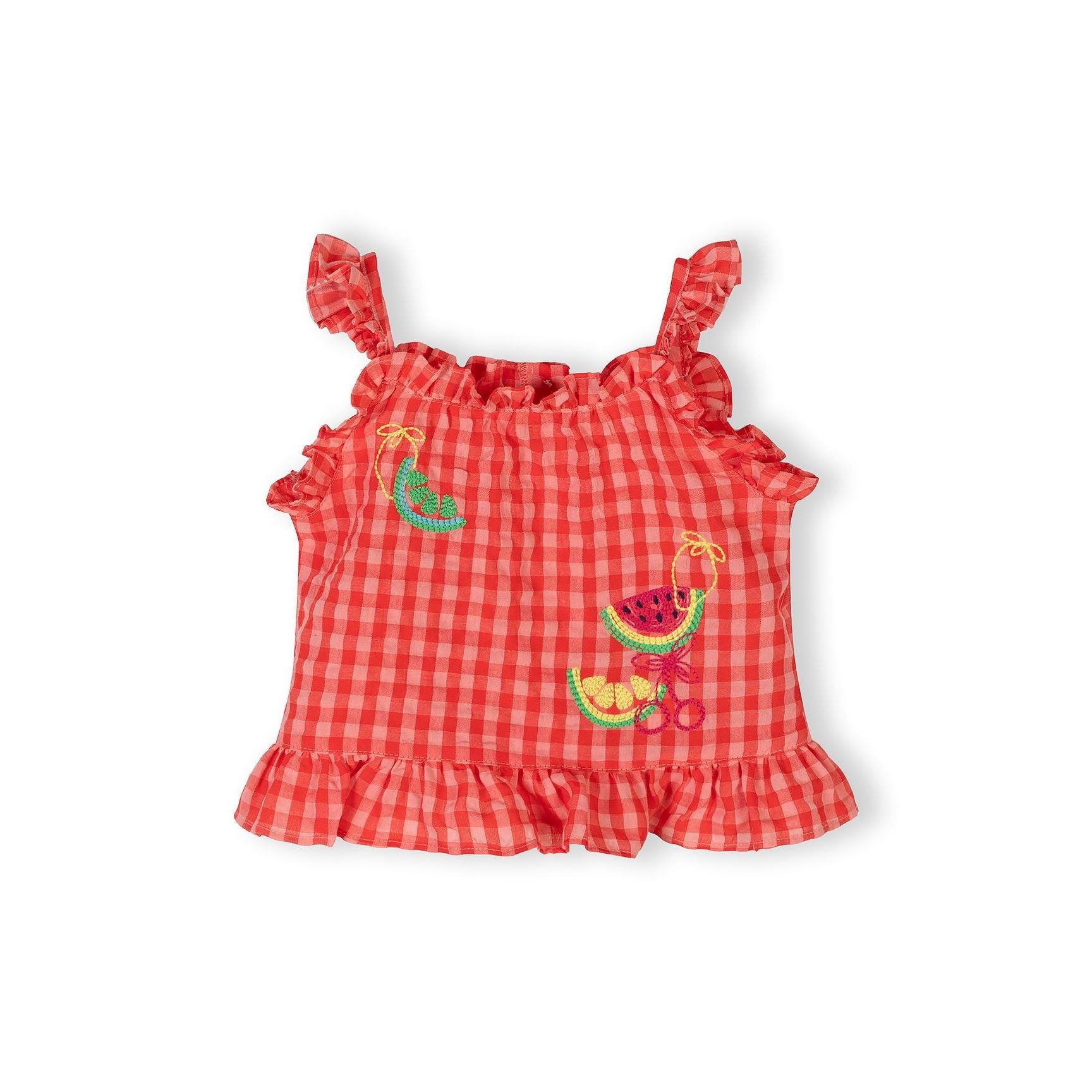 Detailed close-up showing colourful embroidered fruit designs including watermelon and other fruits on red gingham fabric