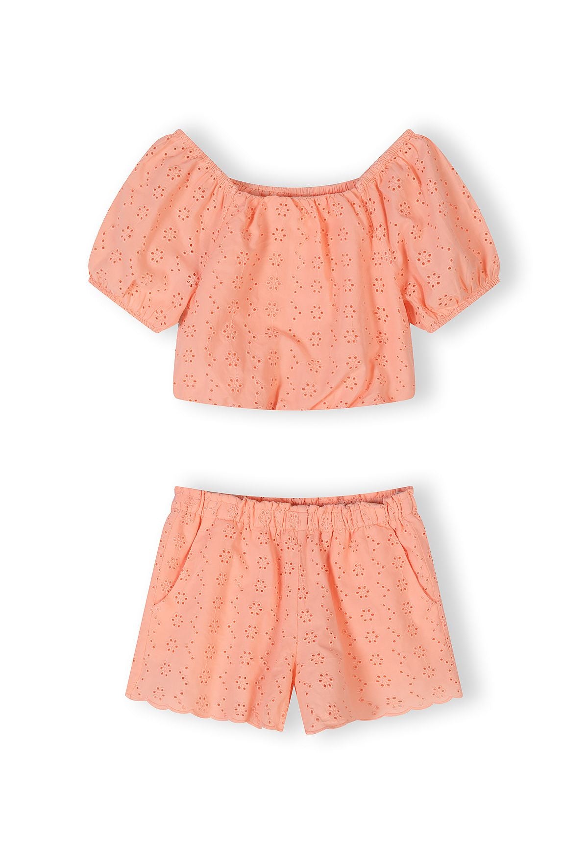 Apricot cotton broderie crop top with off-shoulder design and short puffed sleeves, showing delicate eyelet embroidery pattern, flat lay on white background