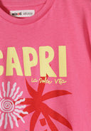Close-up of pink girls activewear top with bright yellow and red graphic design and text detail
