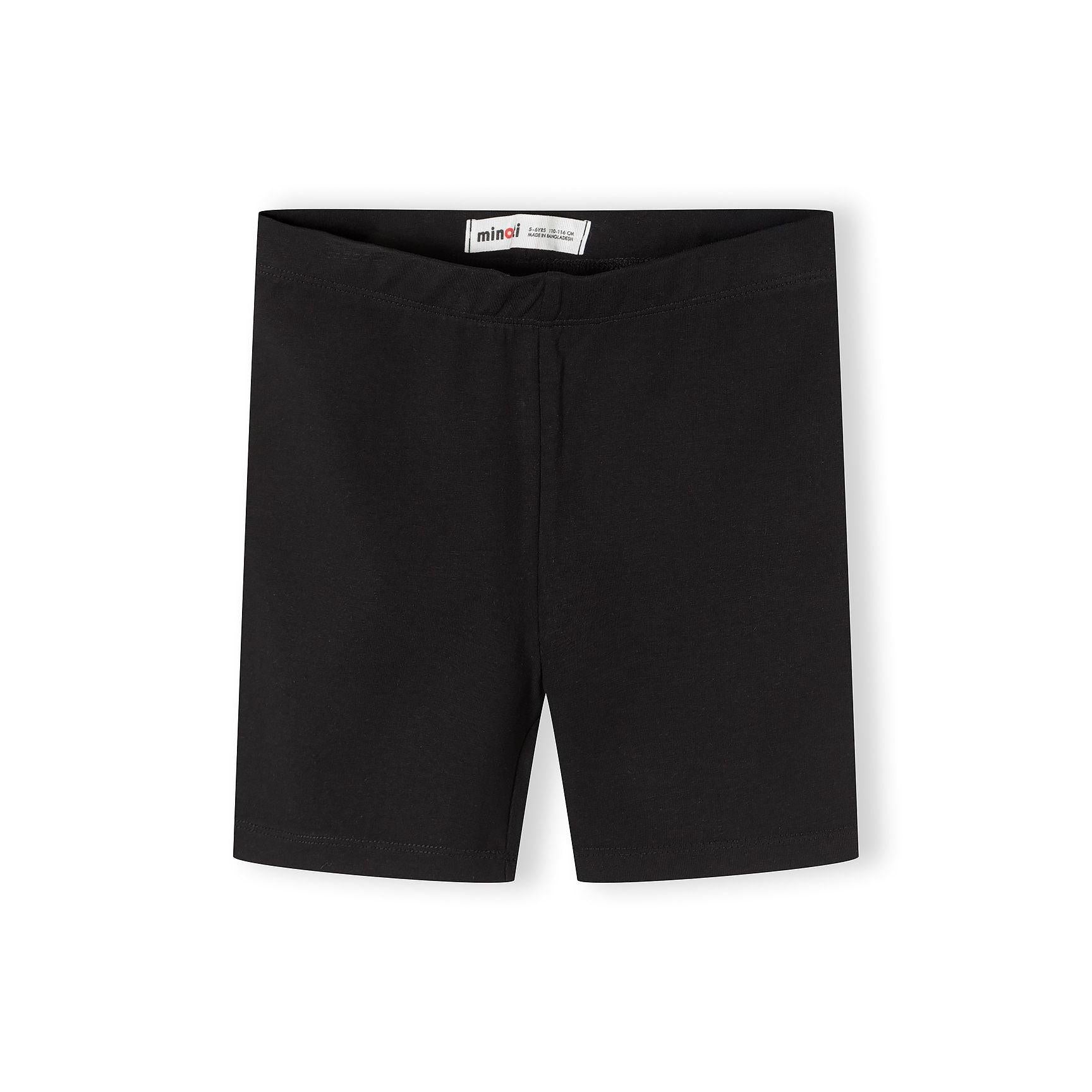 Single pair of bright pink cycling shorts laid flat against white background showing smooth fabric texture and fitted silhouette