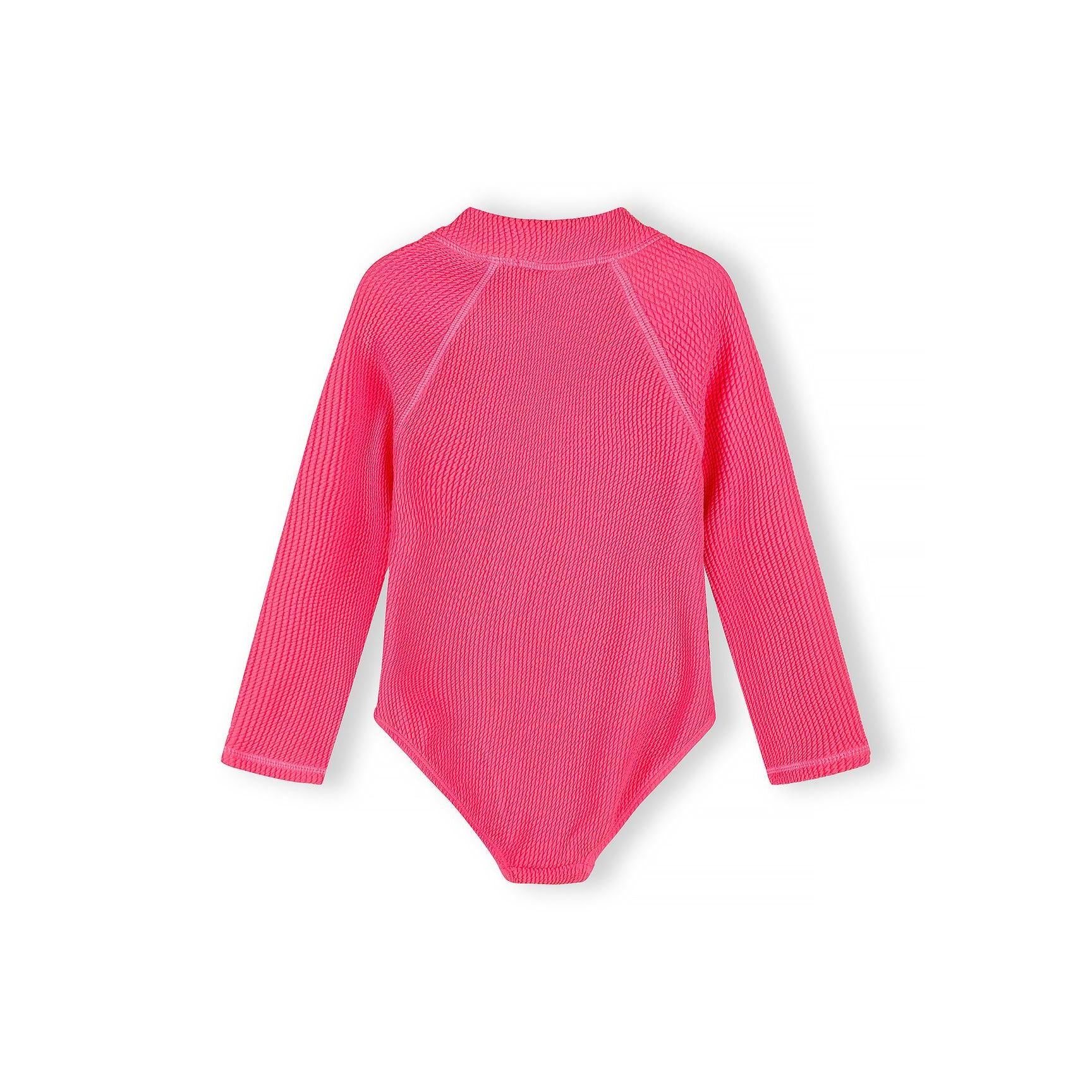 Close-up detail of bright pink ribbed swimsuit fabric texture showing the zip closure and diagonal ribbed pattern