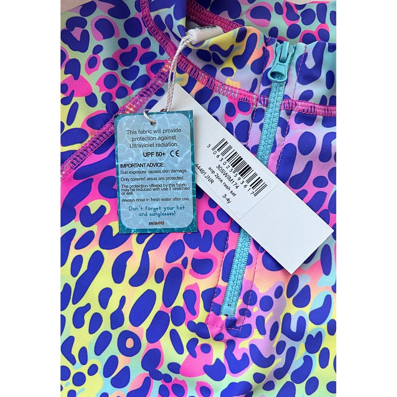 Back view of purple leopard print swim briefs displaying the full animal print pattern with pink and purple tones on white background