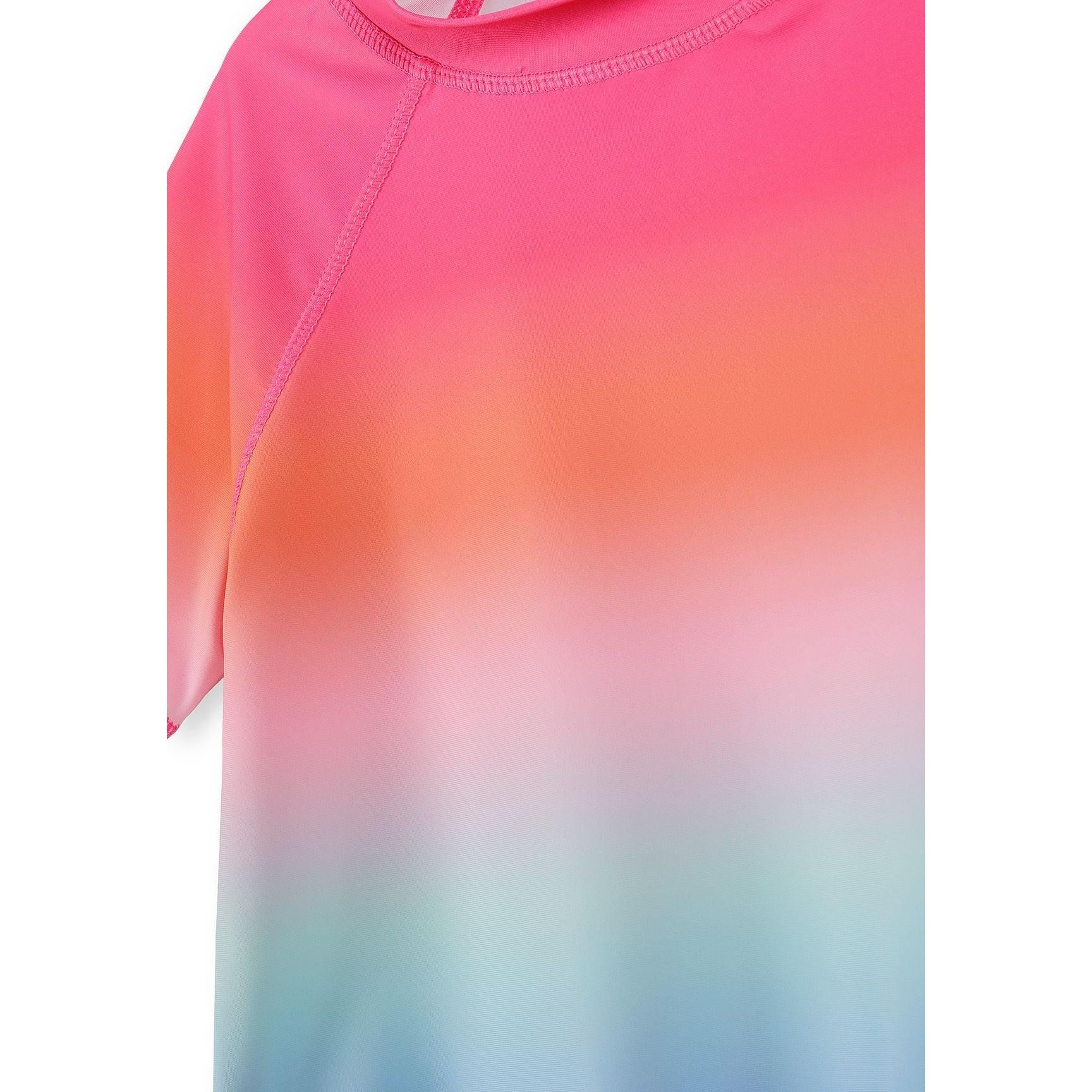 Close-up detail of rainbow ombre gradient effect transitioning from pink through coral to mint blue tones