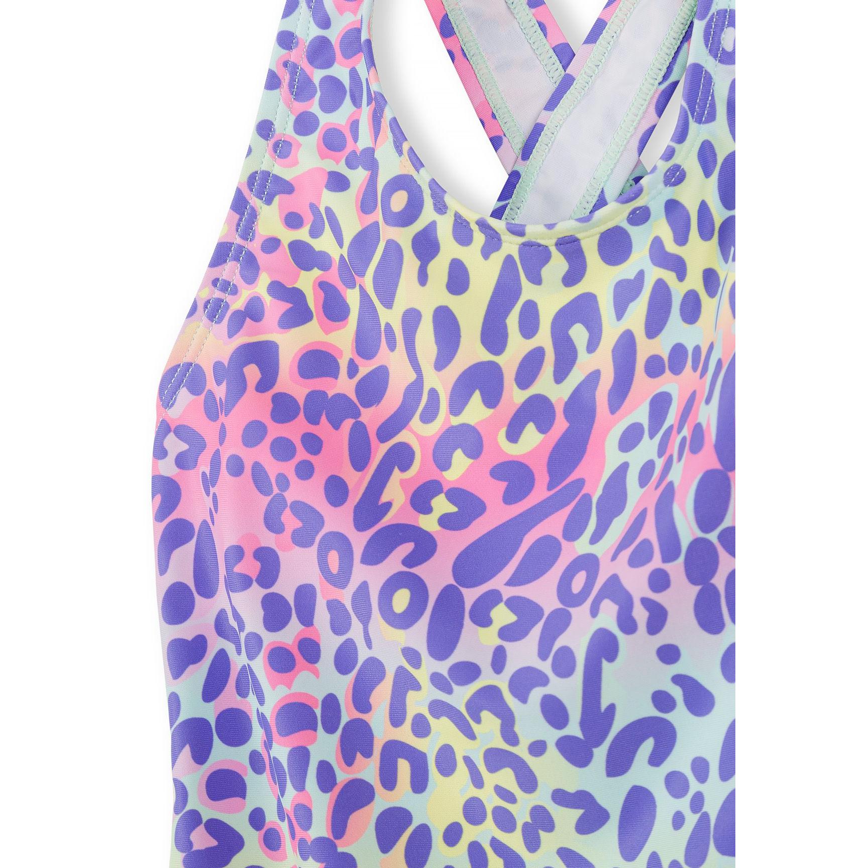 Close-up detail shot of the leopard print pattern and crossover back straps showing the vibrant colour transition and fabric quality