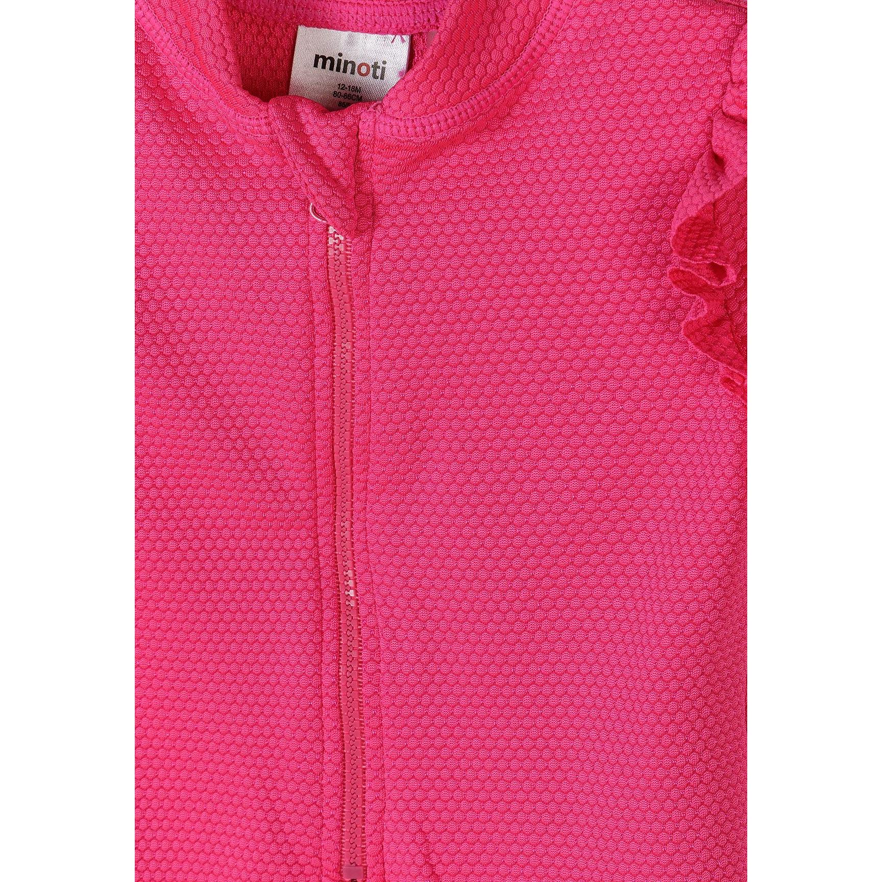 Pink textured rash suit back view showing ruffle sleeves and round neckline on white background