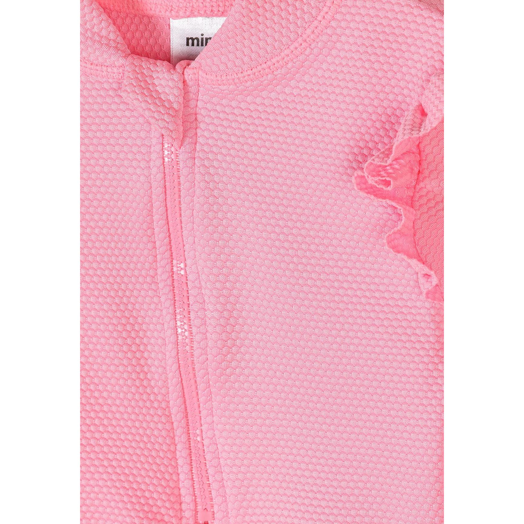Close-up detail of pink floral-shaped children's sunglasses showing CE safety marking and comfortable design